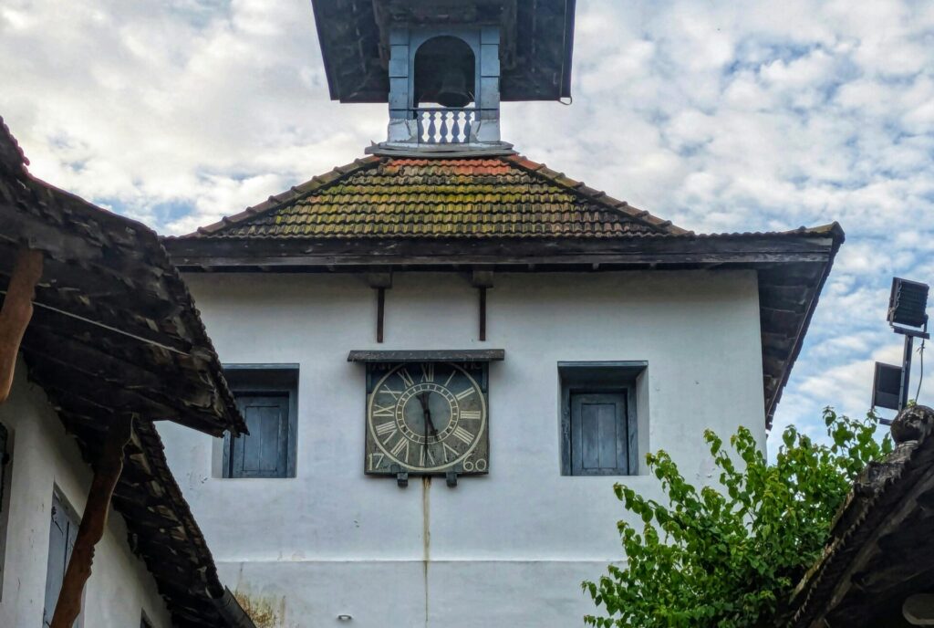 Stunning view of the Paradesi Synagogue clock tower in Fort Kochi, Kerala, showcasing its historical architecture.